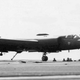 One of the U-2Gs, this one with false registration N808X on the tail, snags an arresting cable.